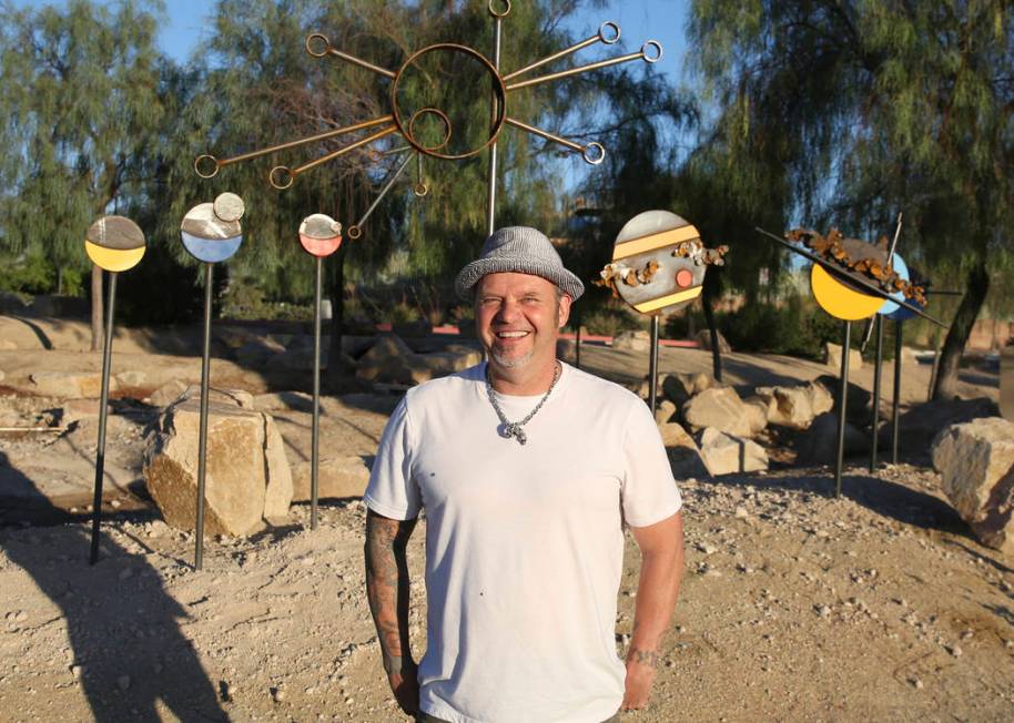 Artist Randy Mendre poses for a photo on Wednesday, June 19, 2019 in front of the sculpture he ...