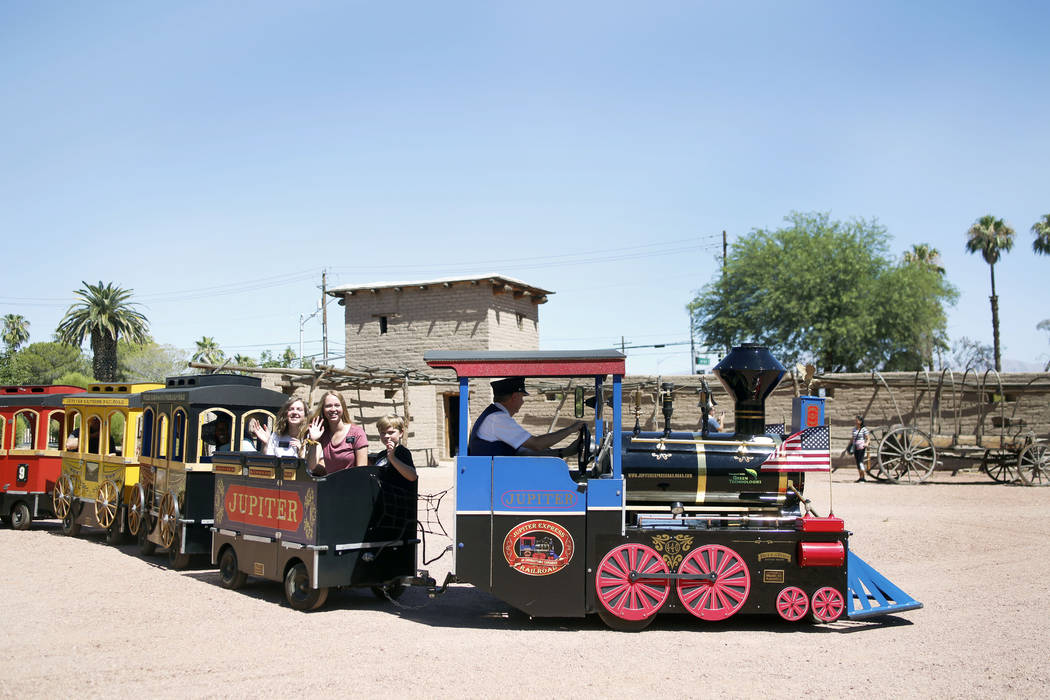 Attendees enjoy a train ride during Pioneer Day at Old Mormon Fort in Las Vegas, Saturday, July ...