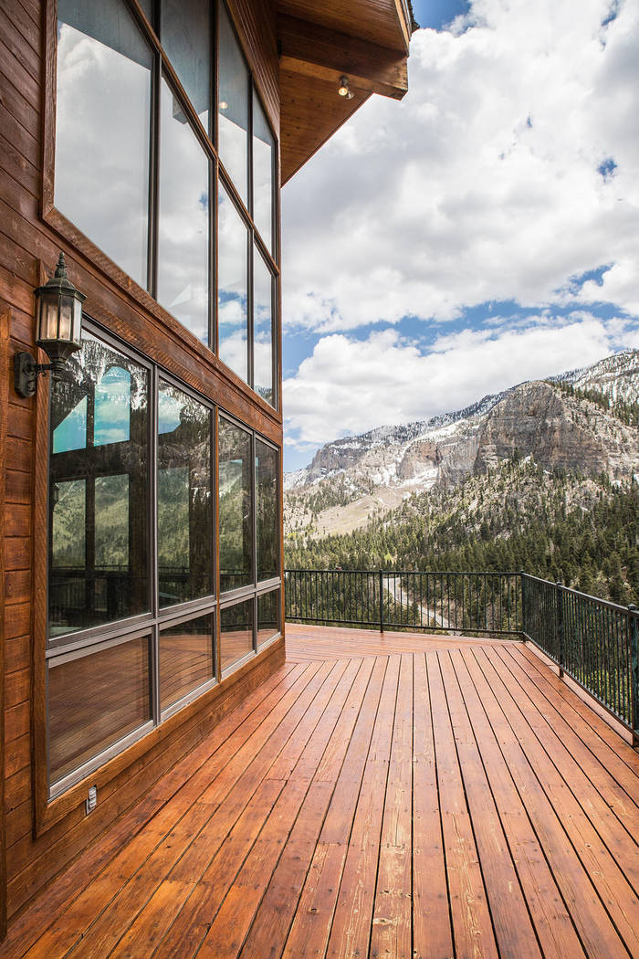 The mountain home has plenty of window walls to view the pine forest and mountains. (Tonya Harv ...