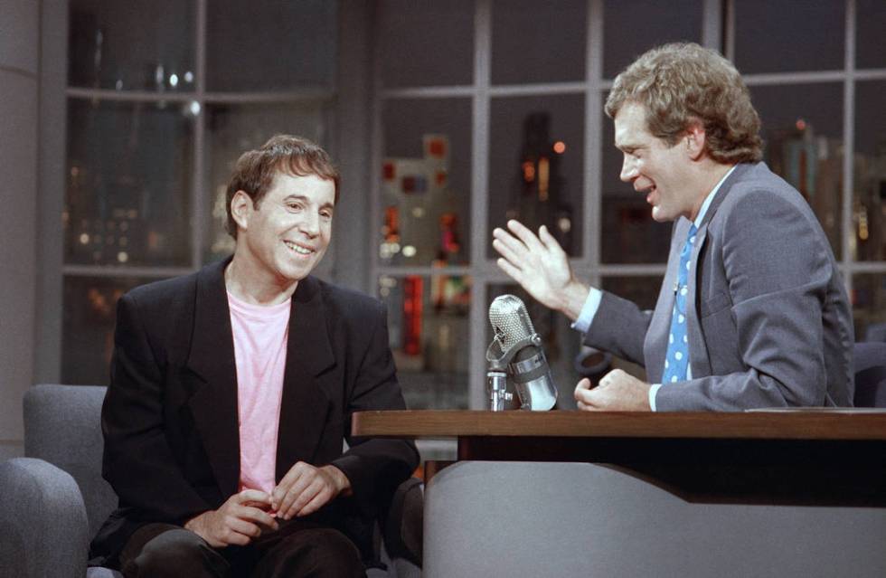 Performer Paul Simon listens to David Letterman on the set of NBC's "Late Night with David Lett ...