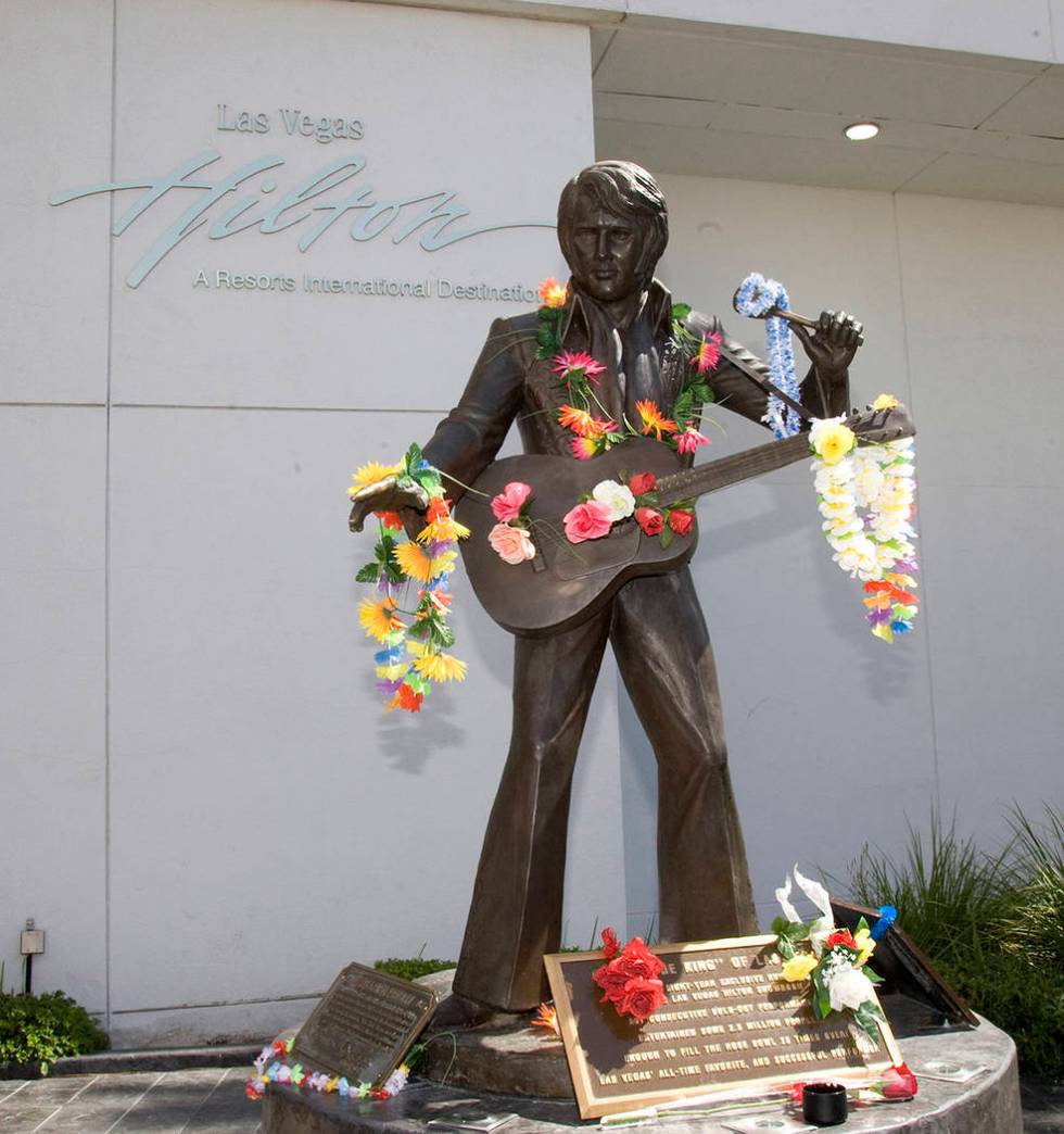 The statue of Elvis located at the Las Vegas Hilton was decorated by fans for the anniversary o ...