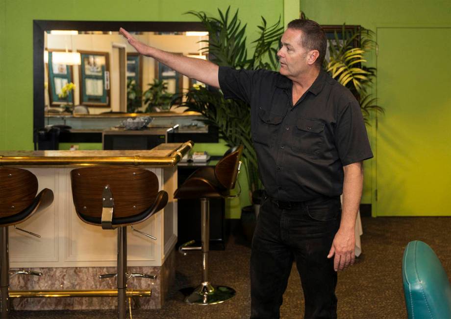 Craig Hayes, crew chief and head carpenter at the International Theater, points out features of ...