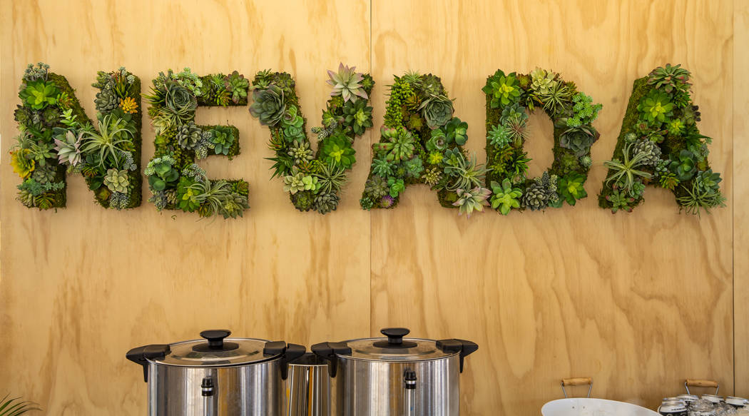 A Nevada sign made of live plants hangs on the wall during a Google Nevada data center investme ...