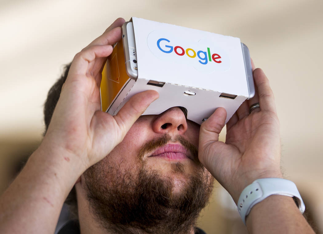 Devin Hyden with Teach Plus checks out a pair of Google Cardboard VR Headsets 3D Box, virtual r ...
