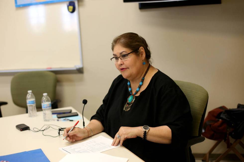 Mayra Crum, a teacher for the city's citizenship class, asks questions of a student at the Stup ...