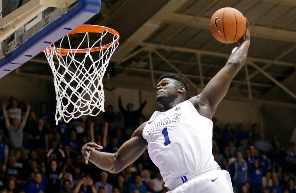 In this Jan. 5, 2019, file photo, Duke's Zion Williamson (1) dunks during the second half of an ...