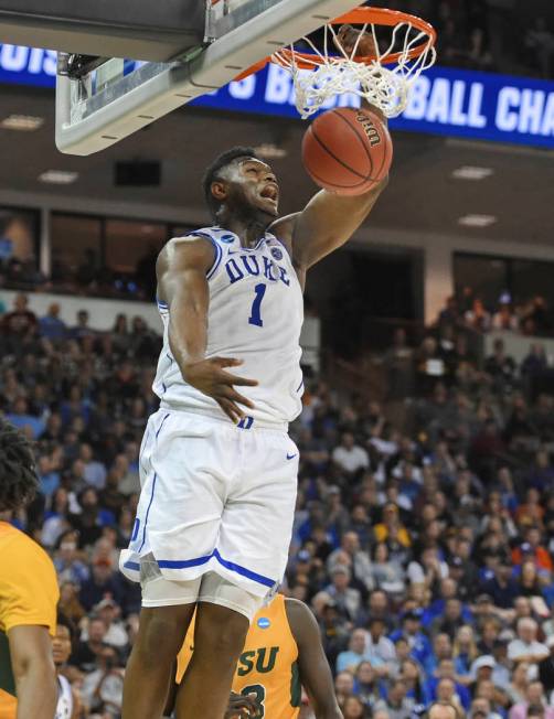 Duke's Zion Williamson dunks against North Dakota State during a first-round game in the NCAA m ...