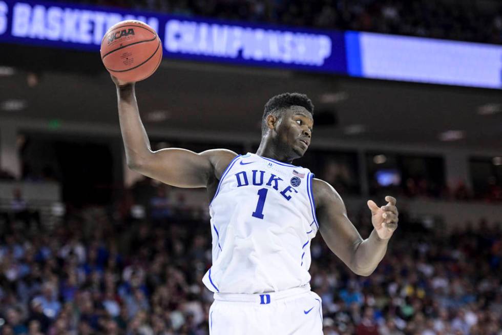 Duke forward Zion Williamson (1) grabs a rebound against Central Florida during the first half ...