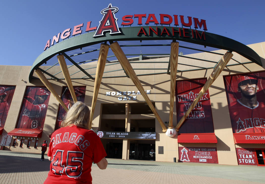 Los Angeles Angel fan Martha Treadway mourns the loss of pitcher Tyler Skaggs at Angel Stadium ...