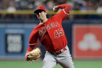 In this June 13, 2019 file photo Los Angeles Angels' Tyler Skaggs pitches to the Tampa Bay Rays ...