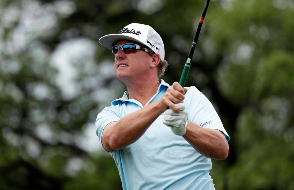 Charley Hoffman watches a shot on the second hole during the final round of the Texas Open golf ...
