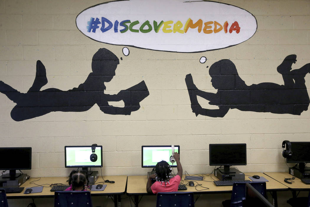 Kindergarten students Mackenzie Blockson, left, and Sorayah Battle prepare to take a test in th ...