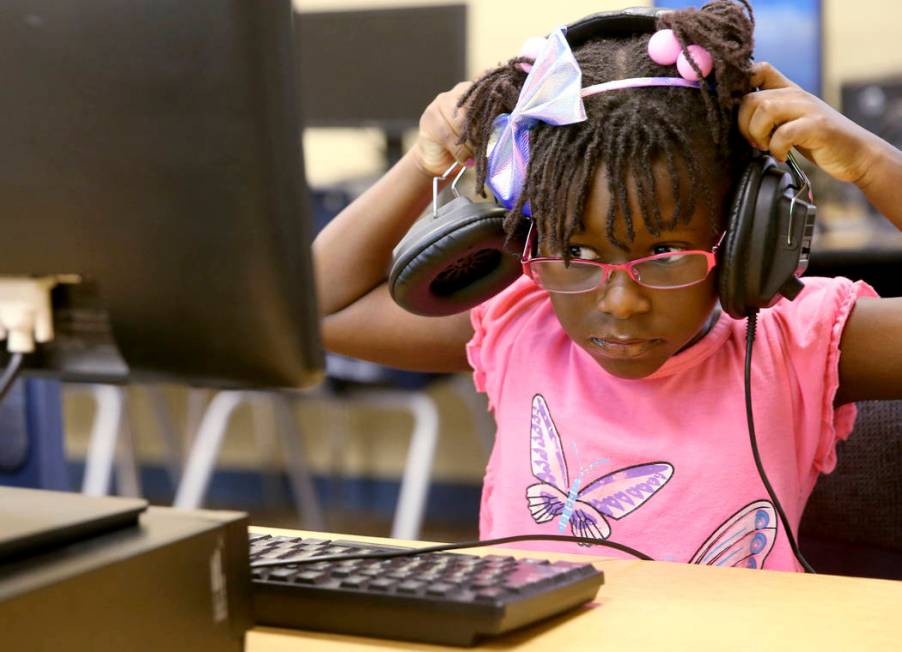 Kindergarten student Gianna Davis prepares to take a test in the library during summer camp at ...