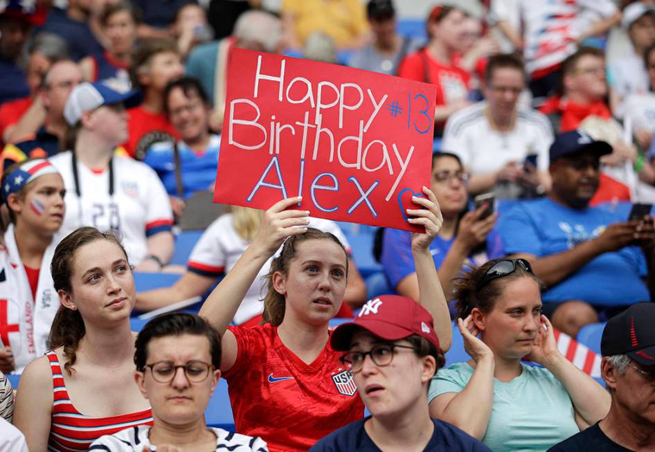 A United States's fan holds a birthday wish banner for United States' Alex Morgan before the Wo ...