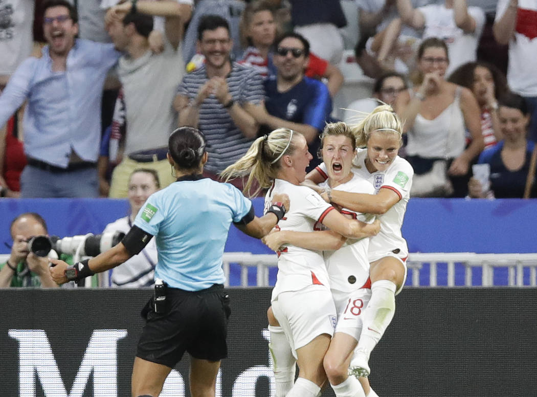 England's Ellen White, center right, celebrates after scoring his side's first goal during the ...