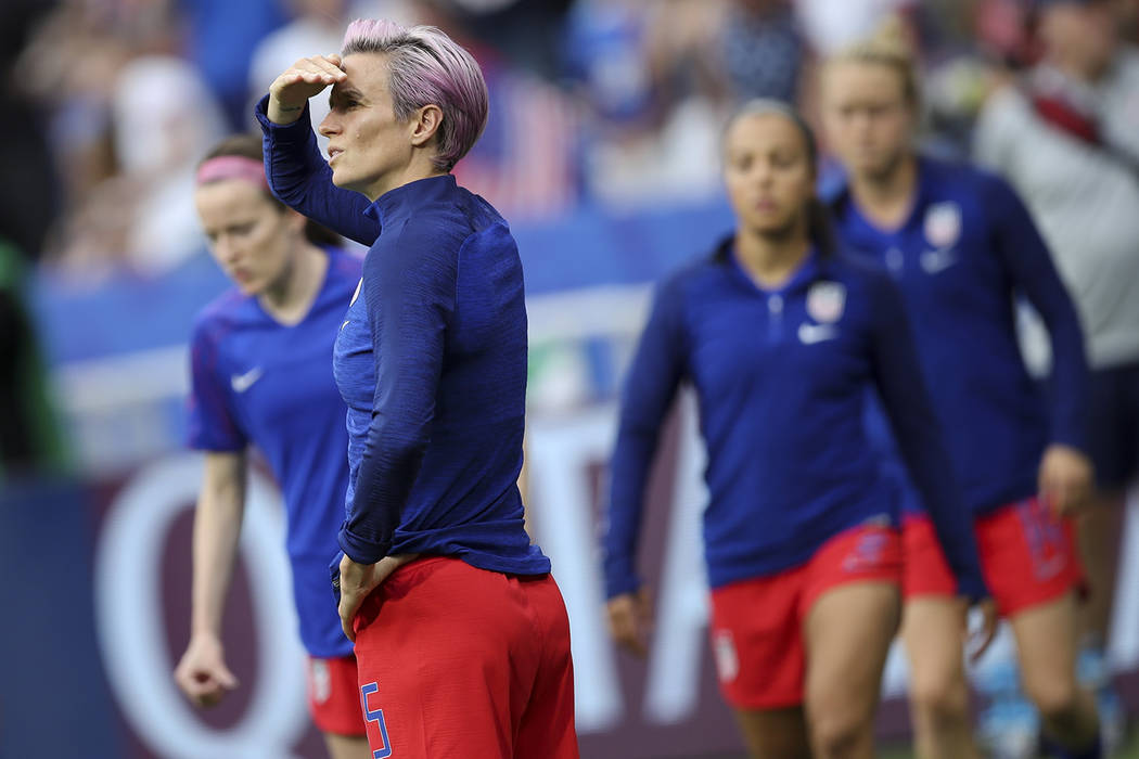 United States' Megan Rapinoe watches teammates warm up before the Women's World Cup semifinal s ...