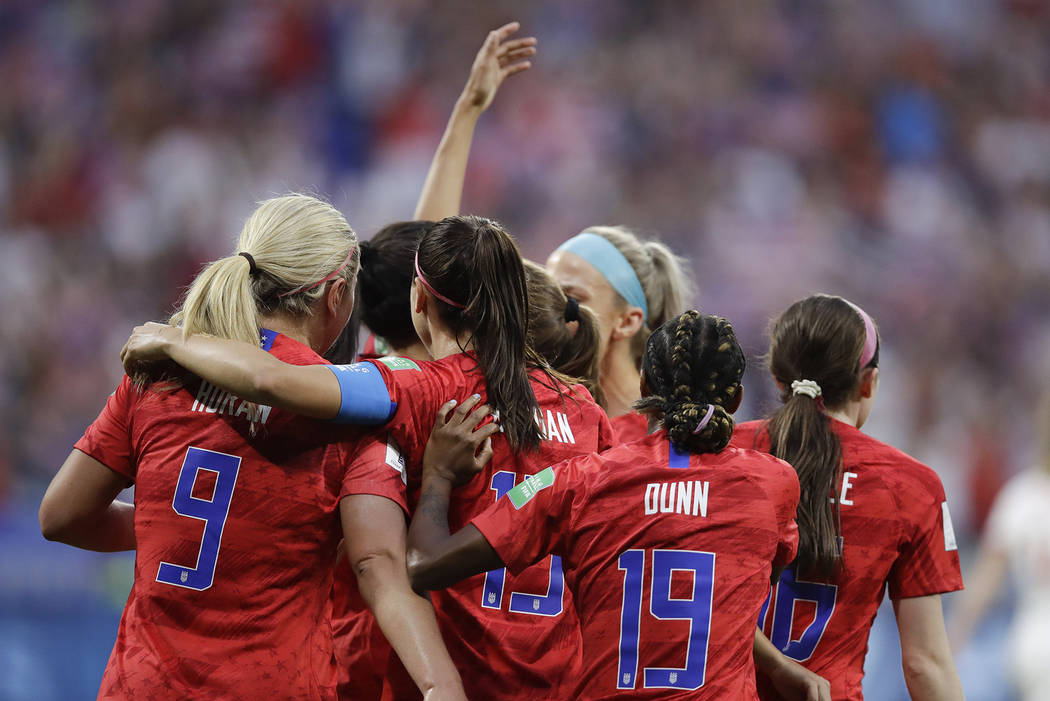 United States' players celebrate after Christen Press scored her side's first goal during the W ...