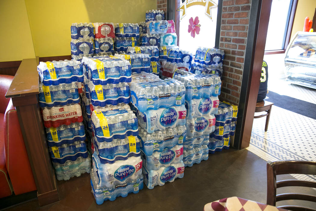 Bottled water donations at Metro Pizza located at 6720 Sky Pointe Drive during their water bott ...