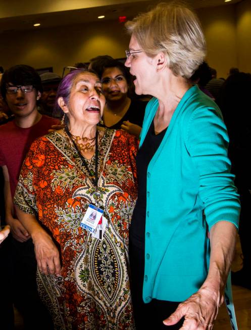 Vicenta Montoya, left, greets Democratic presidential candidate Sen. Elizabeth Warren, D-Mass., ...