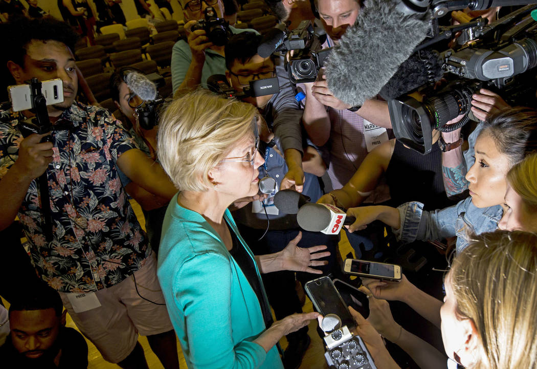 Democratic presidential candidate Sen. Elizabeth Warren, D-Mass., speaks to reporters during a ...