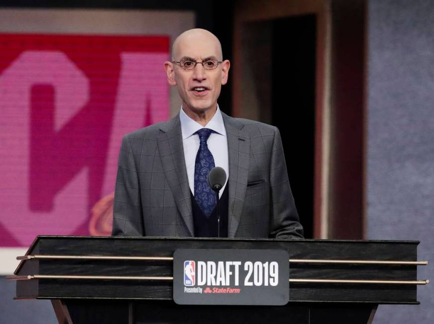 NBA Commissioner Adam Silver announces Vanderbilt's Darius Garland as the fifth pick overall by ...