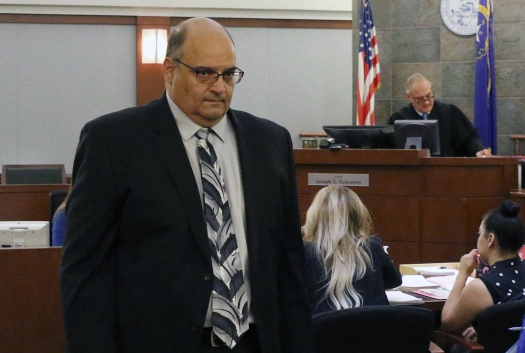 Michael Paglia leaves the courtroom at the Regional Justice Center on Wednesday, July 3, 2019, ...