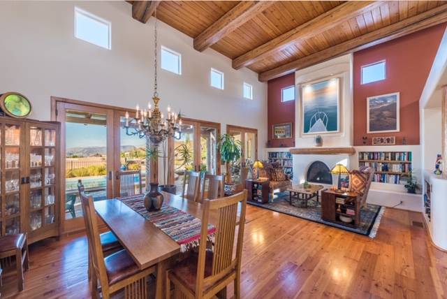 The dining and living room feature wood accents. (Desert Sun Realty)