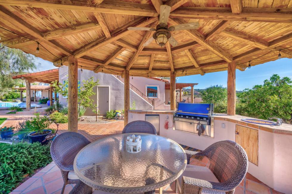 The outdoor kitchen is an entertainment hub. (Desert Sun Realty)