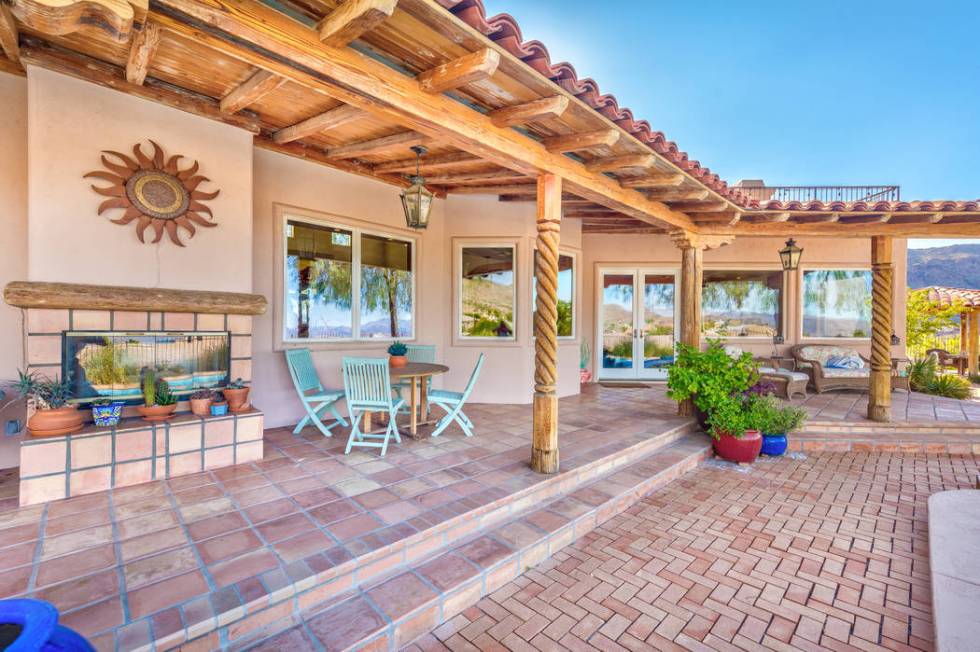 The patio has a fireplace and plenty of sitting areas. (Desert Sun Realty)