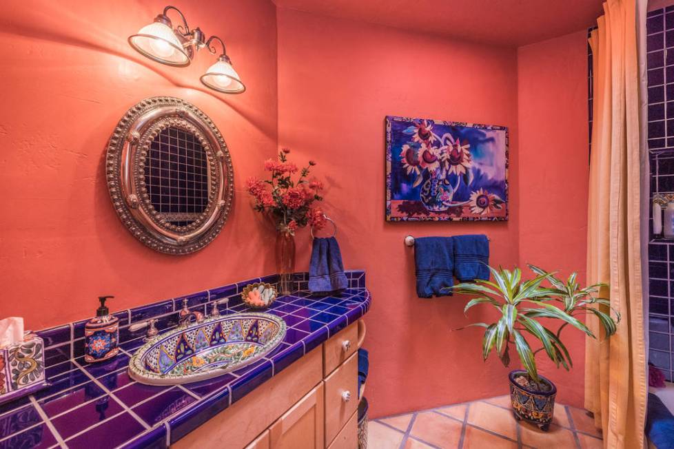 The home's guest bathroom has a splash of color. (Desert Sun Realty)