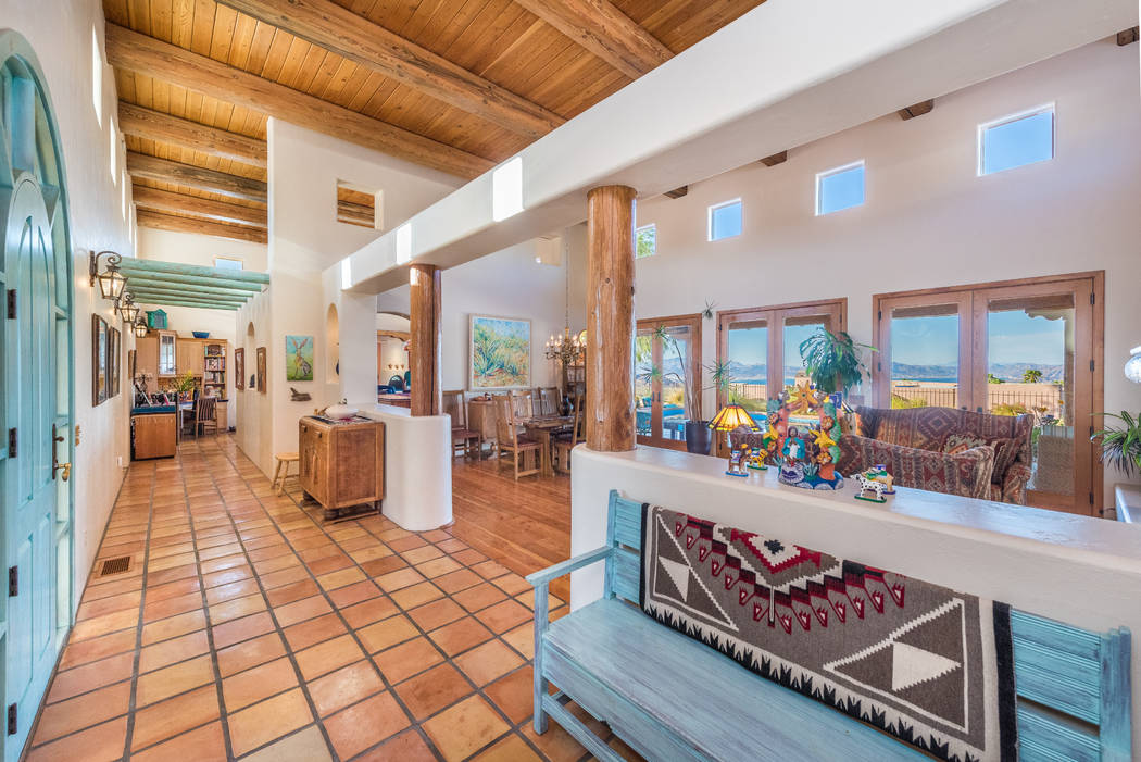 The foyer leads directly into a formal living and dining area. (Desert Sun Realty)