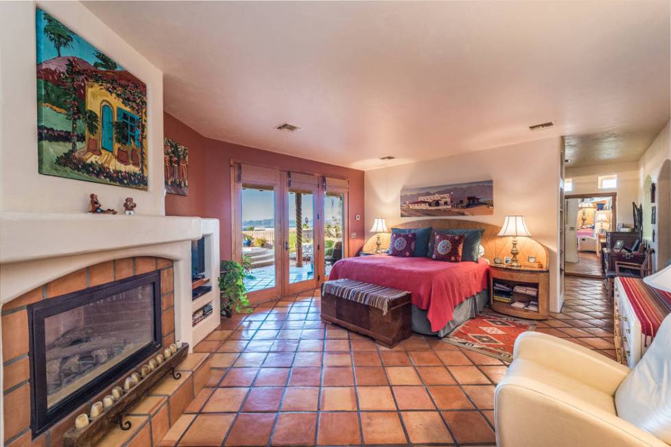 The master suite has a fireplace and access to the spa and pool. (Desert Sun Realty)