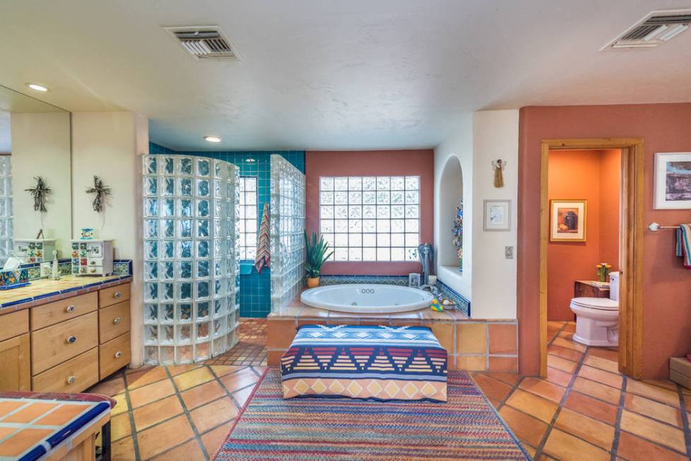 The master bath features Saltillo tile flooring. (Desert Sun Realty)