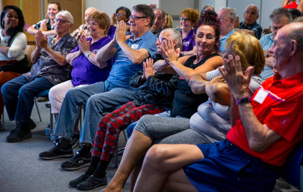 Participants do some group exercises amongst songs, stories and more during a Memory Cafe - Res ...