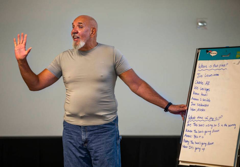 Volunteer Jay Nagle leads a group story amongst songs, exercises and more during a Memory Cafe ...