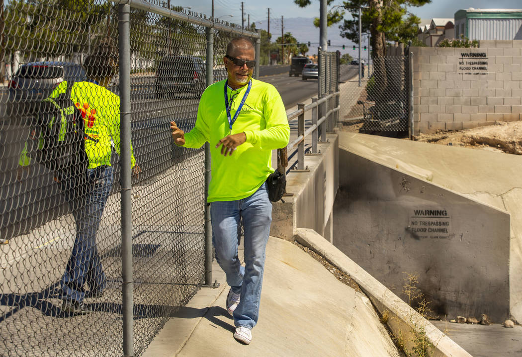 Louis Lacey, director of Crisis Teams at HELP of Southern Nevada, looks down on a drainage ditc ...