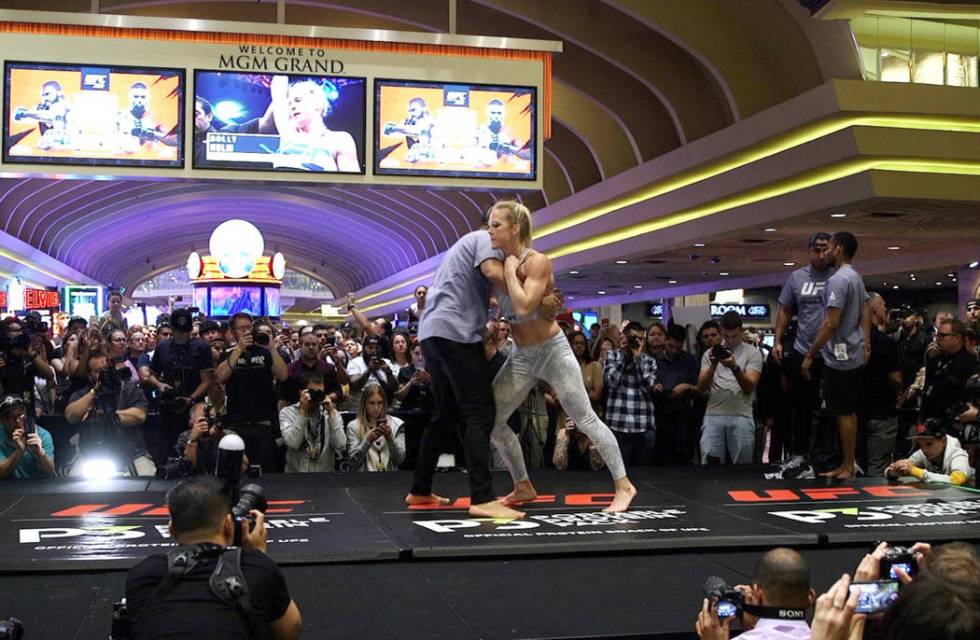 UFC bantamweight contender Holly Holm warms up at the open workouts at the MGM Grand hotel-casi ...