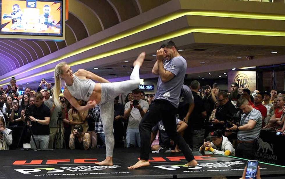 UFC bantamweight contender Holly Holm launches a kick at the open workouts at the MGM Grand hot ...