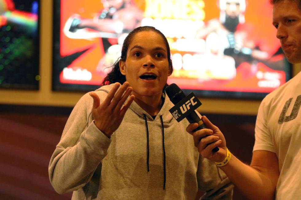 UFC women's bantamweight and featherweight champion Amanda Nunes answers questions at the open ...