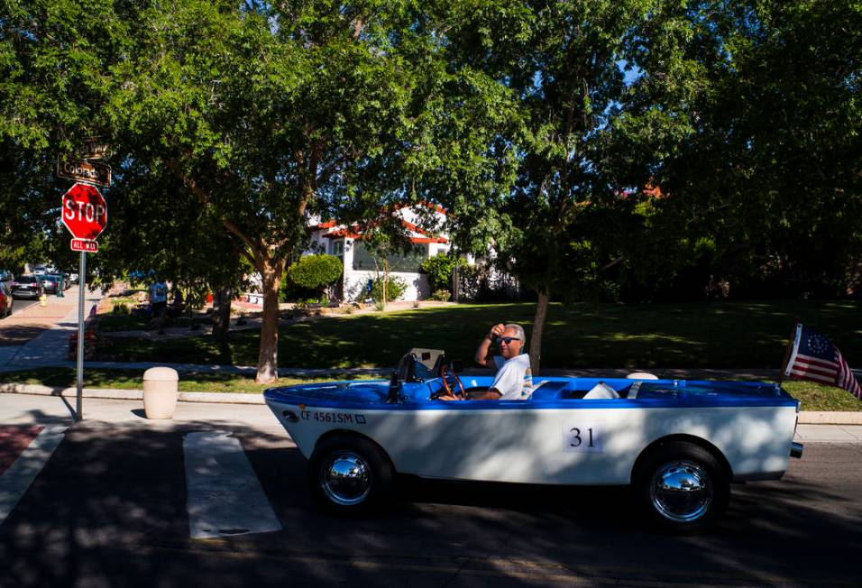 Boulder City resident Kevin Savord drives is boatcar before participating in the parade at the ...