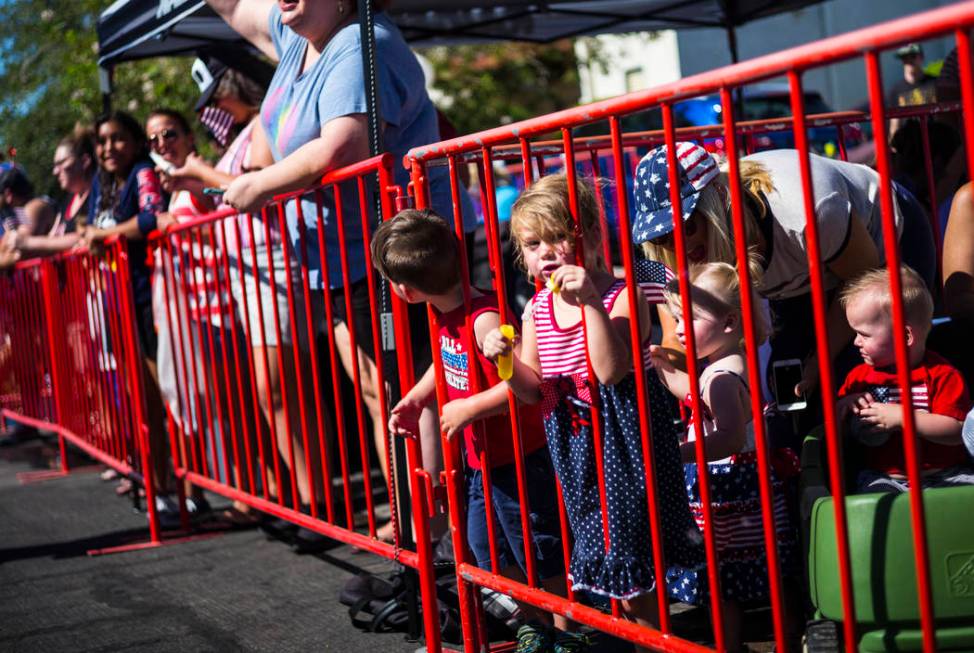 A young spectator blows bubbles while watching the parade at the annual Damboree Celebration in ...