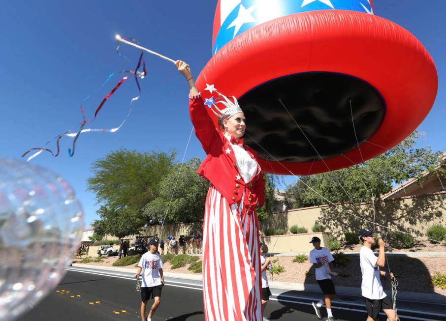 Sara Back waves her baton during the 25th annual Summerlin Council Patriotic Parade on July 4, ...