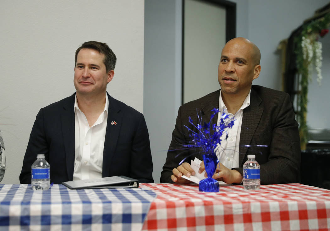Democratic presidential candidates Rep. Seth Moulton, D-Mass., left, and Sen. Cory Booker atten ...