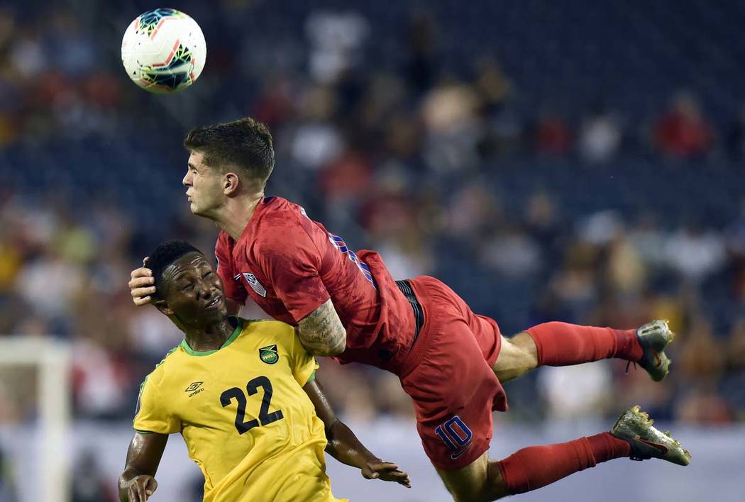 United States midfielder Christian Pulisic (10) heads the ball above Jamaica midfielder Devon W ...
