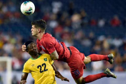 United States midfielder Christian Pulisic (10) heads the ball above Jamaica midfielder Devon W ...