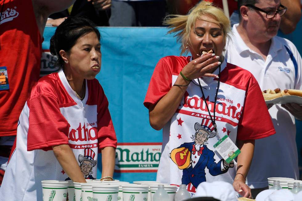 Juliet Lee, left, and Miki Sudo, right, compete in the women's competition of Nathan's Famous J ...