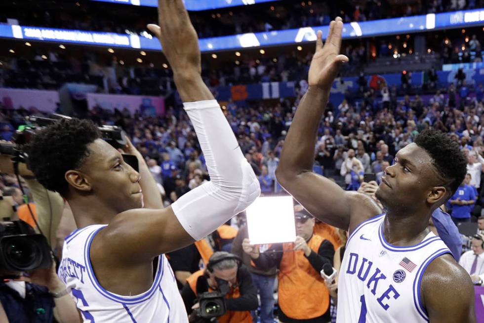 Duke's RJ Barrett (5) and Zion Williamson (1) celebrate after defeating Florida State in the NC ...