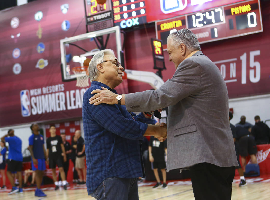 Warren LeGarie, executive director of the Las Vegas Summer League, left, talks with Gov. Steve ...