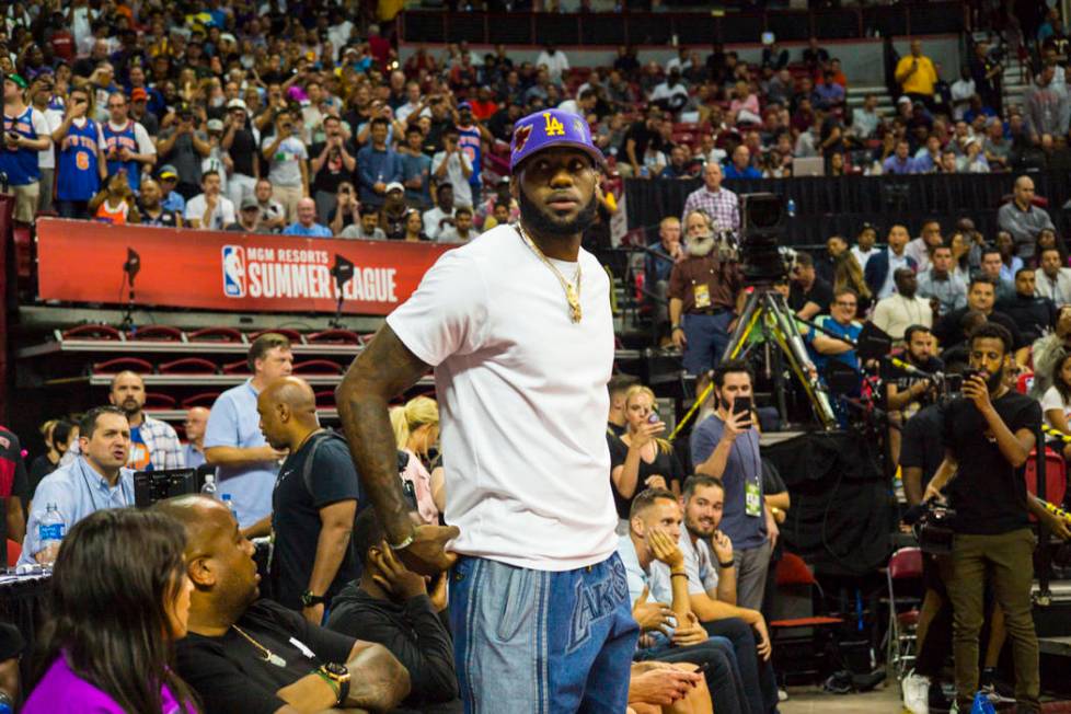 Los Angeles Lakers star LeBron James attends a basketball game between the Lakers and the Chica ...