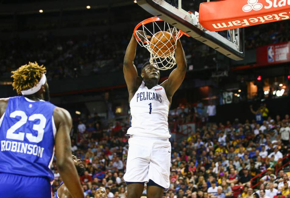 New Orleans Pelicans' Zion Williamson (1) dunks against the New York Knicks during the first ha ...